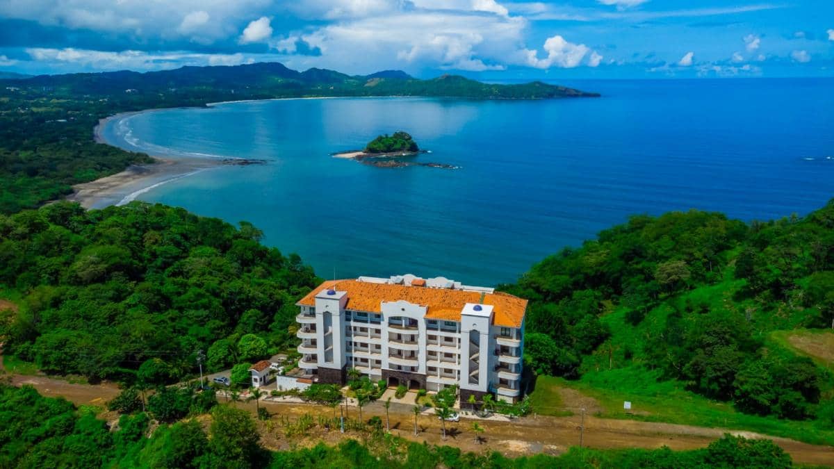 Aerial view of Flamingo Towers in Playa Flamingo, Costa Rica, showing ocean views and close proximity to the beach.