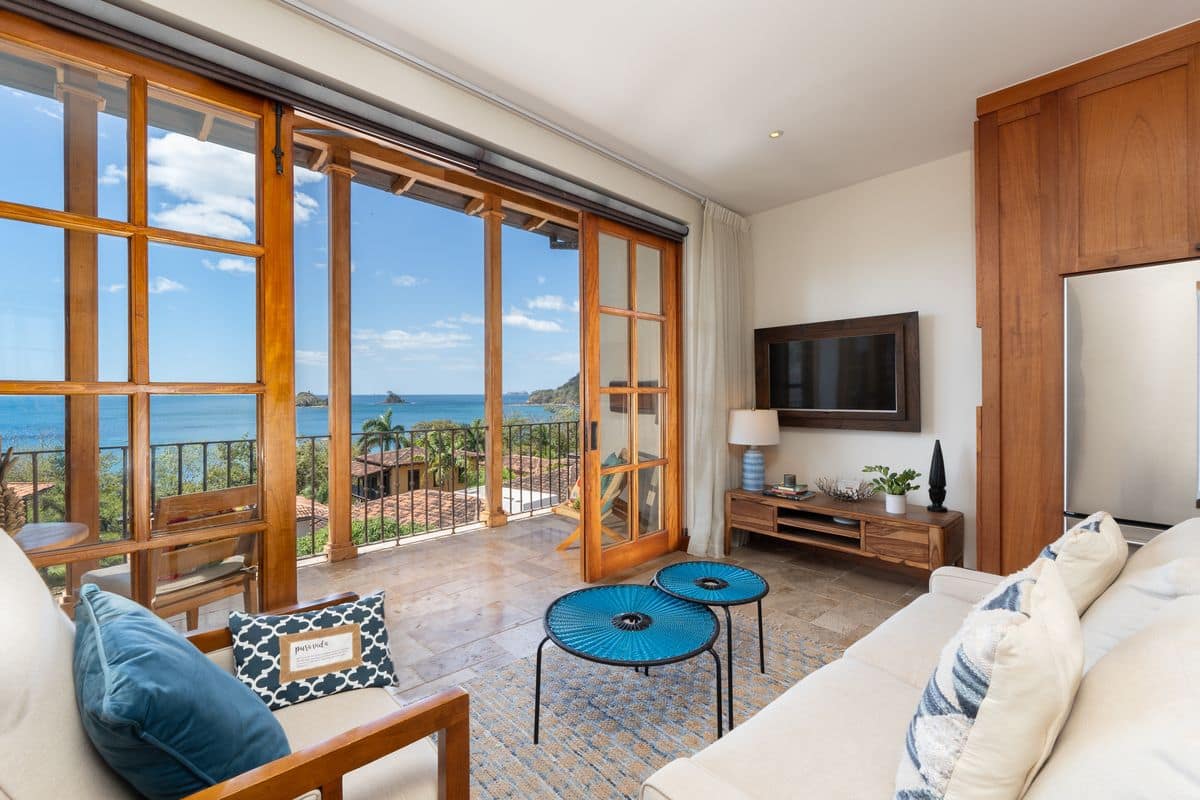 Bright and elegant living room with ocean views at 42 Carlota Penthouse in Las Catalinas.