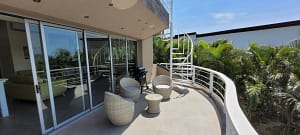 Private balcony with panoramic ocean and mountain views at Casa Nalifos, Playa Flamingo, Costa Rica."