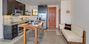 Modern open-concept kitchen at 32 Plaza Central, Las Catalinas – high-end finishes, sleek cabinetry, and ocean views.
