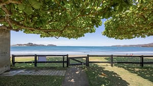 Beautiful Playa Potrero beachfront with calm waters and golden sand at El Destino 1A, Costa Rica.