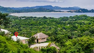 Aerial view of Casa Camari showcasing its hilltop location, luxurious estate, and proximity to Playa Potrero’s pristine beaches.