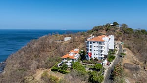 Aerial view of Flamingo Towers in Playa Flamingo, Costa Rica, showing ocean views and close proximity to the beach.
