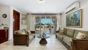 Spacious beachfront living room with ocean views and terrace access at El Destino 1A, Playa Potrero.