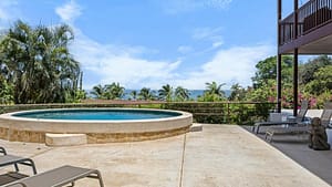 Luxury round dipping pool surrounded by tropical greenery at Casa Veranera, Playa Flamingo