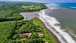 Beachfront lot for sale in Playa Junquillal, Costa Rica, offering ocean views and prime real estate investment opportunity.