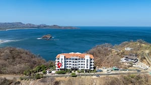 Aerial view of Flamingo Towers in Playa Flamingo, Costa Rica, showing ocean views and close proximity to the beach.