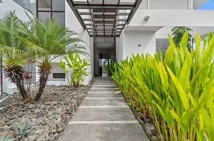 Front entrance hallway at Villa Oceana with modern tropical design, natural materials, and inviting ambiance.