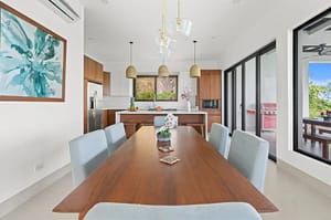 Elegant dining area at Villa Oceana with ocean views, natural light, and modern tropical design.