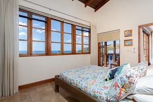 Elegant and airy bedroom with ocean views at 42 Carlota, a luxury penthouse in Las Catalinas.