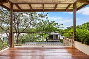 Private balcony with tropical views at Tamarindo Park #51 luxury home in Playa Tamarindo, Costa Rica.