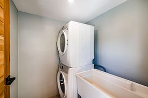 Dedicated Laundry Room with Storage at Casa Nueva Vida in Surfside Estates