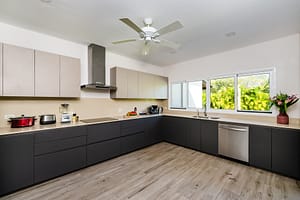 Modern gourmet kitchen at Casa Kenya, featuring high-end appliances, sleek countertops, and an open-concept design in Hacienda Pinilla, Costa Rica.