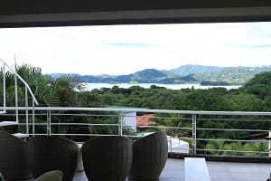 Panoramic ocean and mountain views from the balcony of Casa Nalifos in Playa Flamingo, Costa Rica.