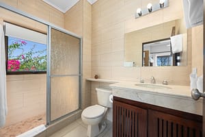 Second bathroom with walk-in shower and modern fixtures at Flamingo Towers 11, Playa Flamingo, Costa Rica.
