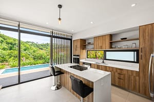 Modern Kitchen with Open Layout and High-End Appliances in Pacifico Resort Home