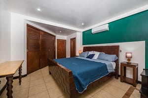 Spacious master bedroom with ensuite bathroom and terrace access in Naxos 8 condo.
