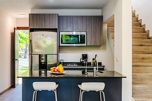 Modern gourmet kitchen at Casa Kenya, featuring high-end appliances, sleek countertops, and an open-concept design in Hacienda Pinilla, Costa Rica.
