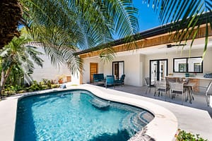 Private Swimming Pool Surrounded by Tropical Gardens at Casa Nueva Vida in Surfside Estates