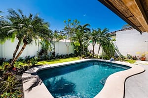 Private Swimming Pool Surrounded by Tropical Gardens at Casa Nueva Vida in Surfside Estates