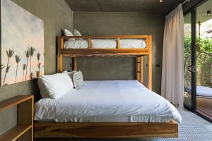 Comfortable second and third bedrooms at Villa Aquarena with king beds and bunk beds for families or groups