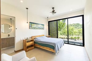 Spacious Master Bedroom with En-Suite Bath and Tropical Views in Pacifico Resort Home
