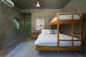 Comfortable second and third bedrooms at Villa Aquarena with king beds and bunk beds for families or groups