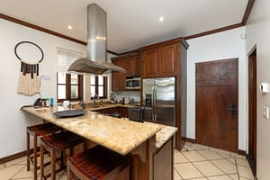 Gourmet kitchen with high-end appliances, custom cabinetry, and ocean views at 9 Paseo del Mar, Las Catalinas.