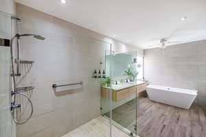 Elegant bathroom at Casa Kenya featuring modern fixtures, a spa-like ambiance, and high-end finishes in Hacienda Pinilla, Costa Rica.
