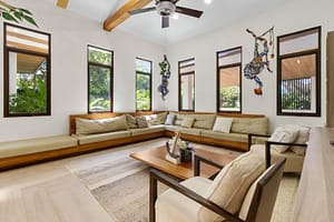 Elegant sunken living area at Casa Artistica, featuring custom-painted walls, stylish furnishings, and an open layout for relaxation and entertaining.