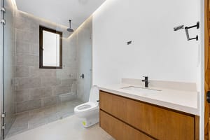 Luxurious modern bathroom with high-end finishes at Tamarindo Park #51 in Playa Tamarindo, Costa Rica.