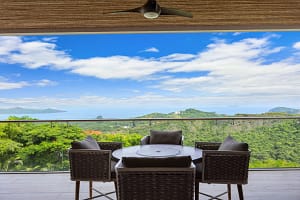 Private bedroom balcony with breathtaking ocean and mountain views at Casa Seahorse in Mar Vista, Playa Flamingo.