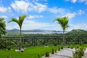 Casa Camari’s beautifully landscaped gardens featuring lush tropical plants, stone pathways, and serene outdoor spaces.