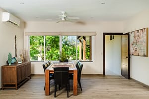 Elegant dining area at Casa Kenya, featuring a spacious open-concept layout, modern furnishings, and seamless indoor-outdoor living in Hacienda Pinilla, Costa Rica.