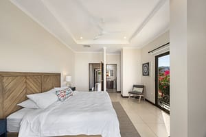Master bedroom with ocean view and hardwood furnishings at Flamingo Towers 11, Playa Flamingo.