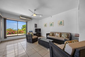 Cozy living room in the 2-bedroom guest unit with garden views and natural lighting at Casa Veranera