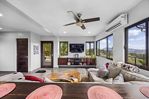Bright and spacious living room with large windows, natural light, and breathtaking views of the surrounding landscape.