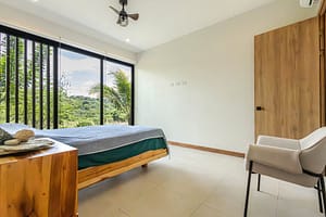 Spacious Master Bedroom with En-Suite Bath and Tropical Views in Pacifico Resort Home