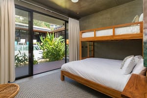 Comfortable second and third bedrooms at Villa Aquarena with king beds and bunk beds for families or groups