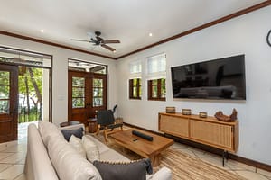 Elegant ocean-view living room with seamless indoor-outdoor design at 9 Paseo del Mar, Las Catalinas.