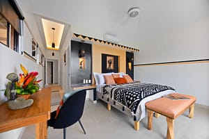 Stylish and uniquely designed bedrooms at Casa Camari, each featuring elegant furnishings, custom decor, and stunning ocean or mountain views.