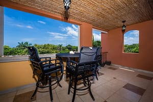 Wraparound balcony with partial Pacific Ocean views in Naxos 8 condominium.