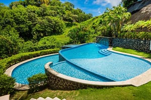 Sparkling pool at Flamingo Towers, Playa Flamingo, Costa Rica, offering a refreshing retreat with ocean views.