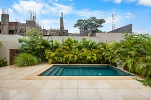 Luxury private pool surrounded by tropical greenery at Tamarindo Park #51 in Playa Tamarindo, Costa Rica.