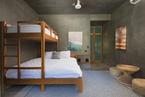 Comfortable second and third bedrooms at Villa Aquarena with king beds and bunk beds for families or groups