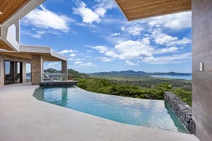 Infinity-edge pool at Casa Manta Ray with panoramic ocean views in Playa Flamingo, Costa Rica.