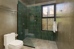 Luxurious modern bathroom at Villa Aquarena with elegant finishes and natural light