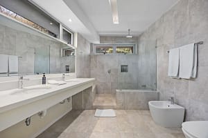 Luxury bathrooms with modern features at Casa Nalifos, Playa Flamingo, Costa Rica.