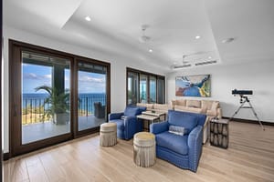 Spacious and elegant living room with ocean views, modern furnishings, and floor-to-ceiling windows at 360 Splendor del Pacifico Flamingo, Unit 502.