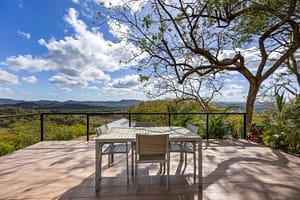 Spacious third-floor terrace with stunning mountain views and a peek-a-boo ocean view, perfect for relaxation.